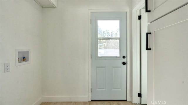 washroom featuring light hardwood / wood-style floors and hookup for a washing machine