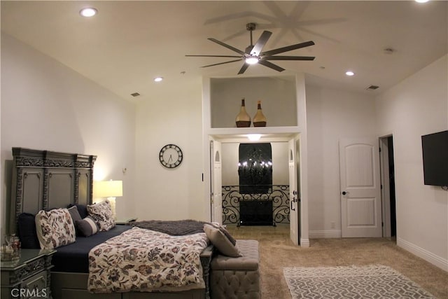 bedroom featuring high vaulted ceiling, recessed lighting, light carpet, and baseboards