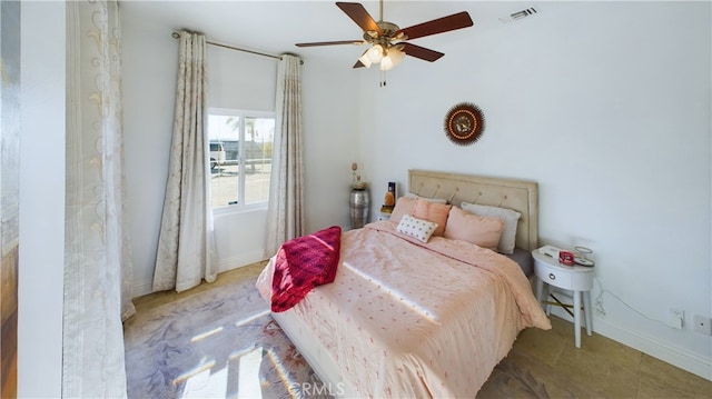 bedroom with a ceiling fan, visible vents, and baseboards