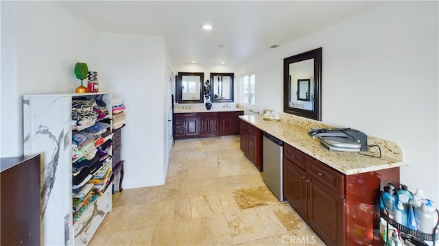 bathroom featuring a spacious closet and recessed lighting