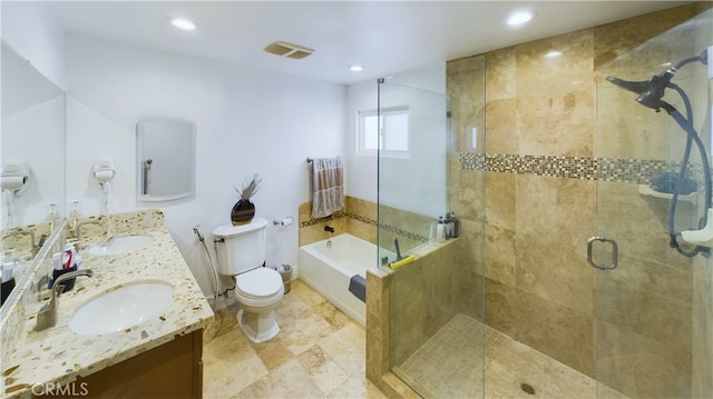 bathroom featuring visible vents, a sink, a shower stall, and double vanity