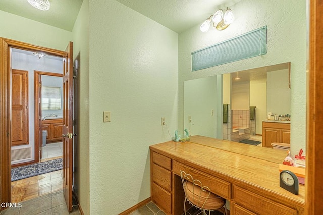 bathroom with sink and tile patterned floors