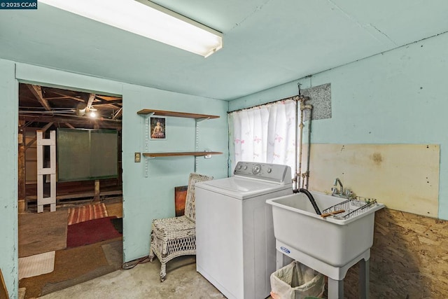 washroom featuring sink and washer / clothes dryer