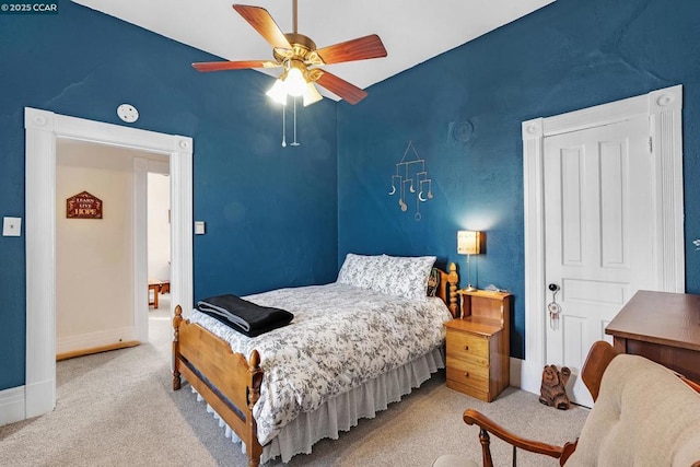 carpeted bedroom featuring ceiling fan