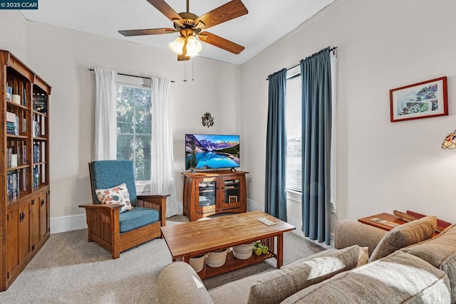 living area featuring ceiling fan and light carpet