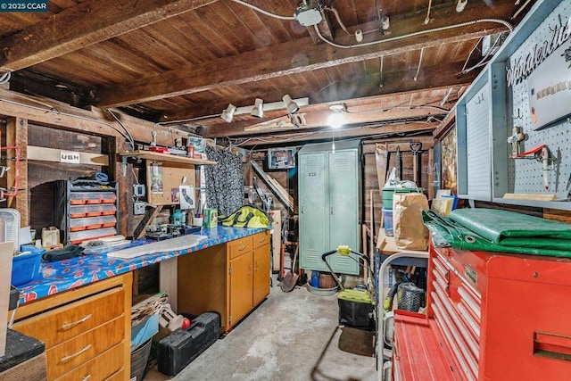 basement with wood ceiling and a workshop area