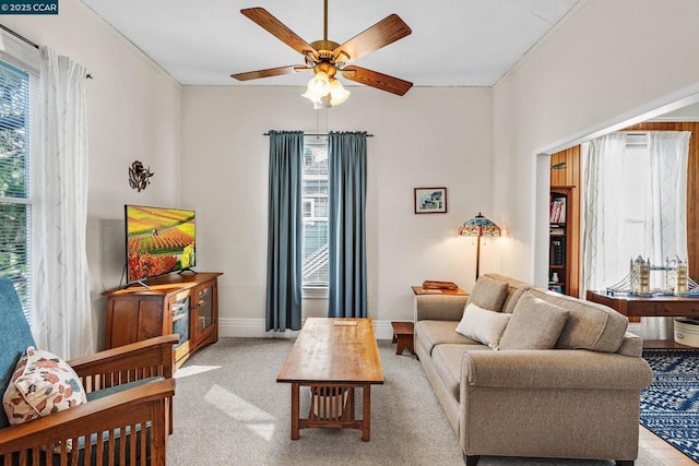 living room featuring ceiling fan and light carpet