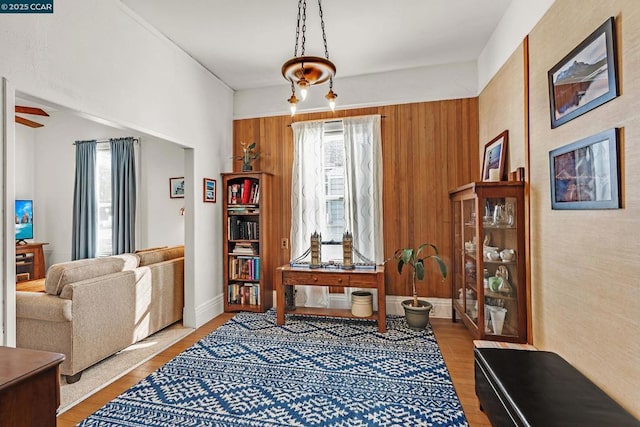 living area with ceiling fan and light hardwood / wood-style flooring