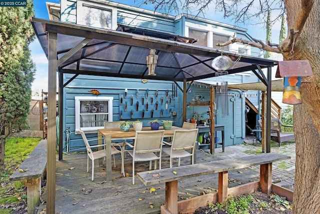 wooden terrace featuring a gazebo