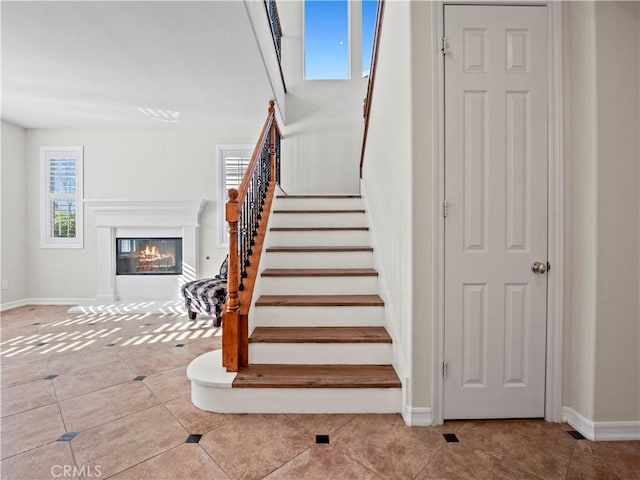 stairs featuring tile patterned flooring