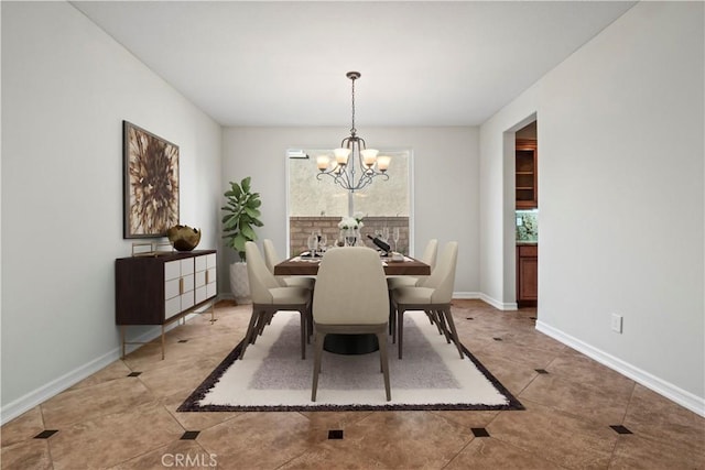 tiled dining room featuring a notable chandelier