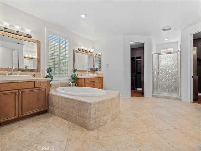 bathroom with vanity, tile patterned floors, and independent shower and bath