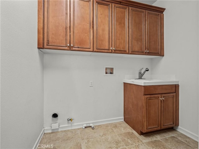 laundry area with gas dryer hookup, washer hookup, sink, and cabinets