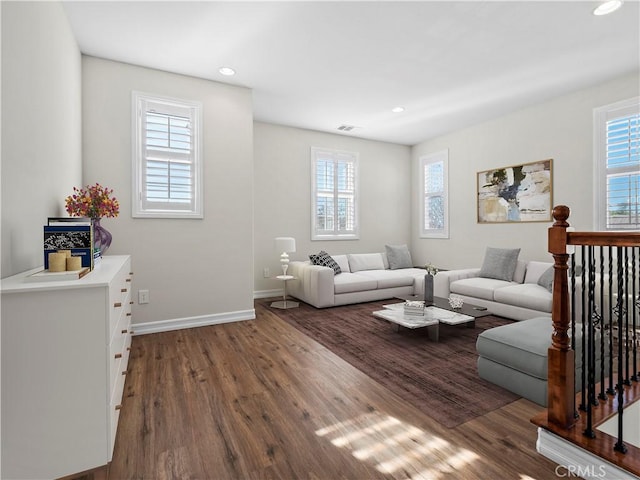 living room with dark hardwood / wood-style floors