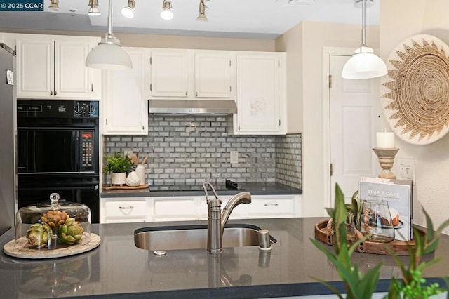 kitchen with black appliances, decorative light fixtures, white cabinetry, decorative backsplash, and sink