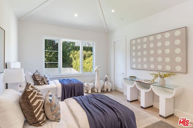 bedroom with lofted ceiling with beams