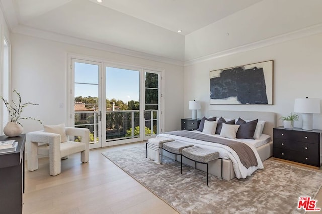 bedroom with access to outside and light hardwood / wood-style floors