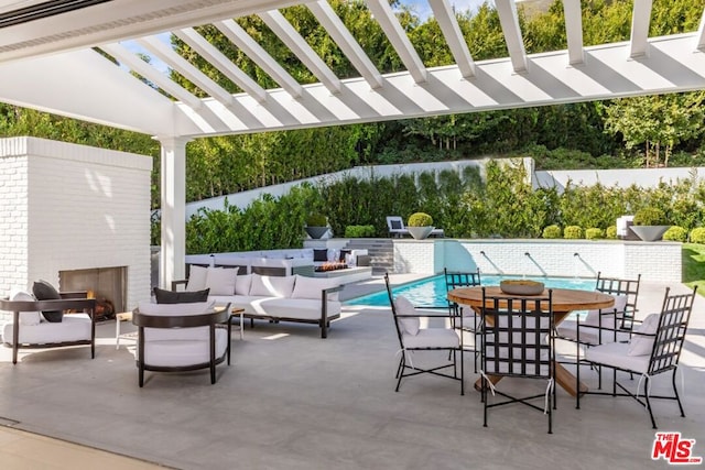 view of patio featuring a pergola, a fenced in pool, and an outdoor living space with a fireplace