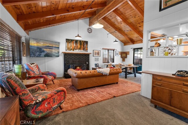 living room with a fireplace, carpet floors, and beam ceiling