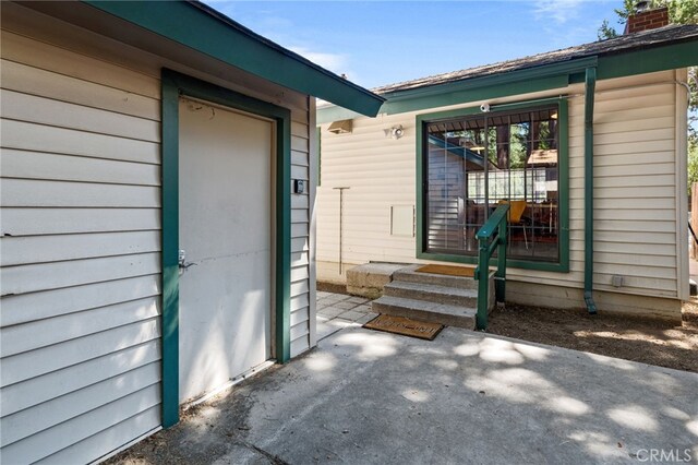 property entrance with a patio area