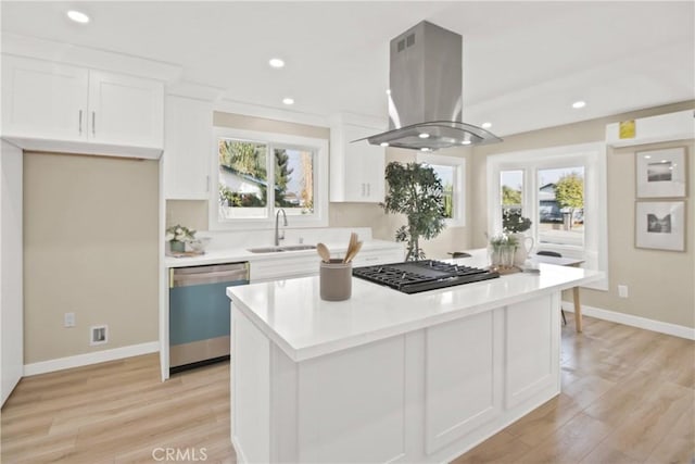 kitchen featuring dishwasher, island exhaust hood, black gas cooktop, white cabinetry, and sink