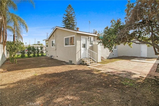 rear view of property with a patio area