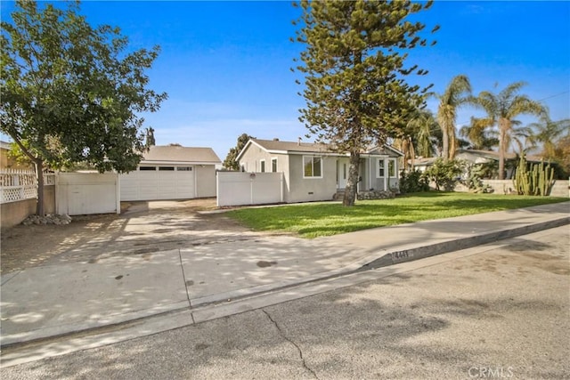 ranch-style home featuring a front yard and a garage