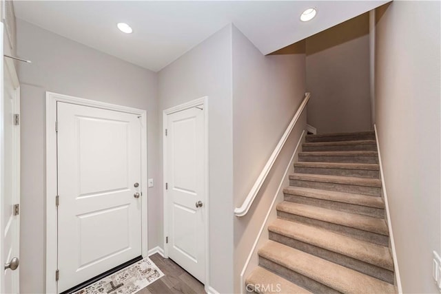 staircase featuring hardwood / wood-style floors