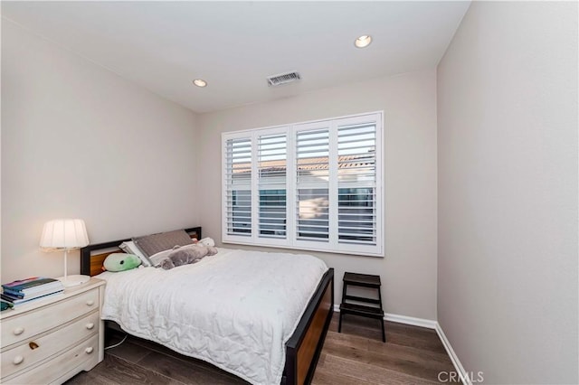 bedroom featuring dark hardwood / wood-style floors