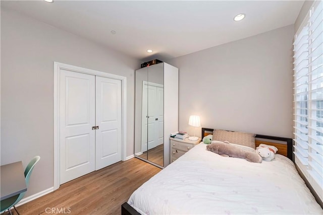 bedroom with wood-type flooring