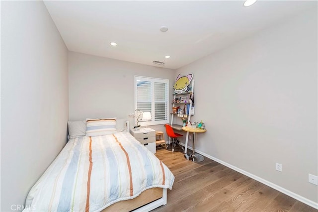 bedroom with light wood-type flooring