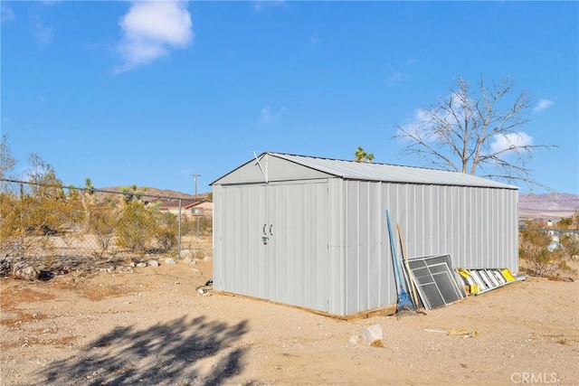 32758 Spinel Rd, Lucerne Valley, CA 92356 - view of outdoor structure featuring an outbuilding and fence