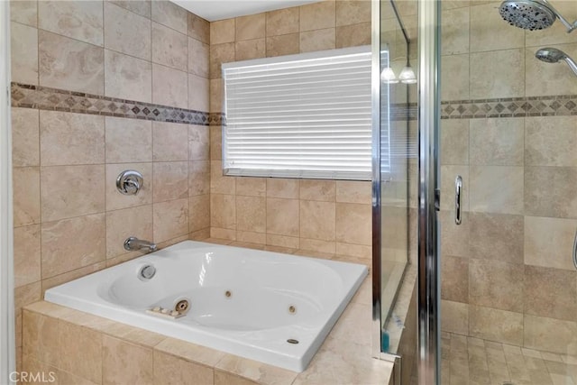 bathroom featuring separate shower and tub