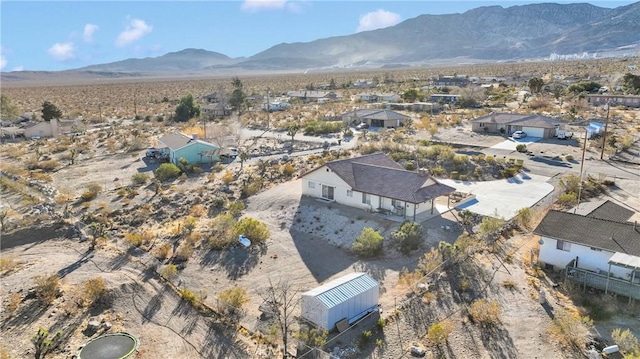 birds eye view of property with a mountain view