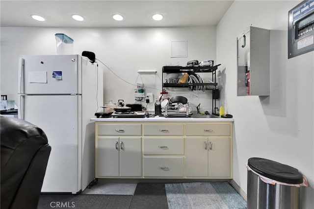 32758 Spinel Rd, Lucerne Valley, CA 92356 - kitchen with light countertops, open shelves, recessed lighting, cream cabinetry, and freestanding refrigerator