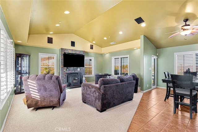 tiled living room featuring lofted ceiling and ceiling fan