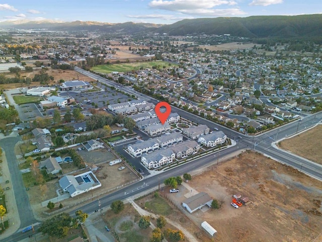 birds eye view of property featuring a mountain view