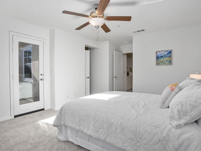 bedroom featuring ceiling fan, light carpet, and access to exterior