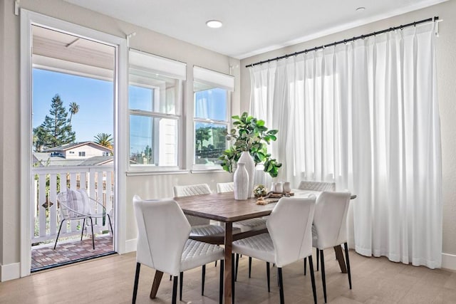 dining area with light hardwood / wood-style flooring