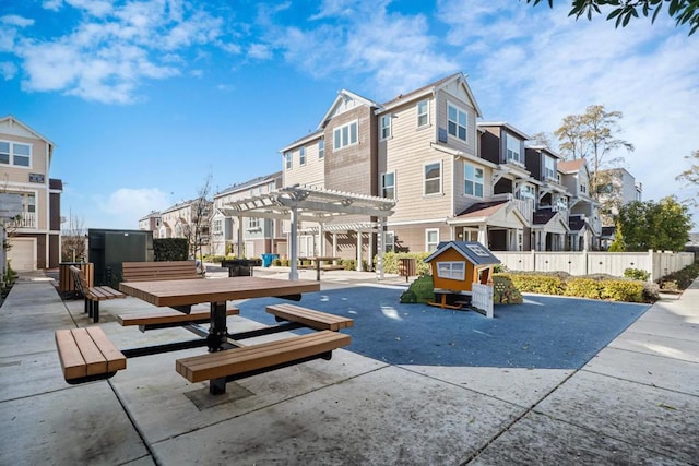 view of home's community featuring a pergola