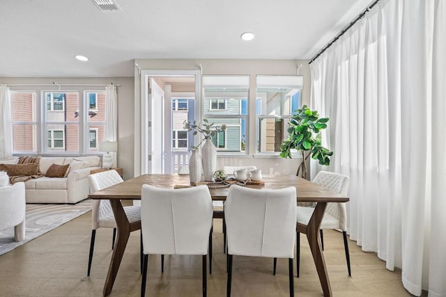 dining room with light hardwood / wood-style floors