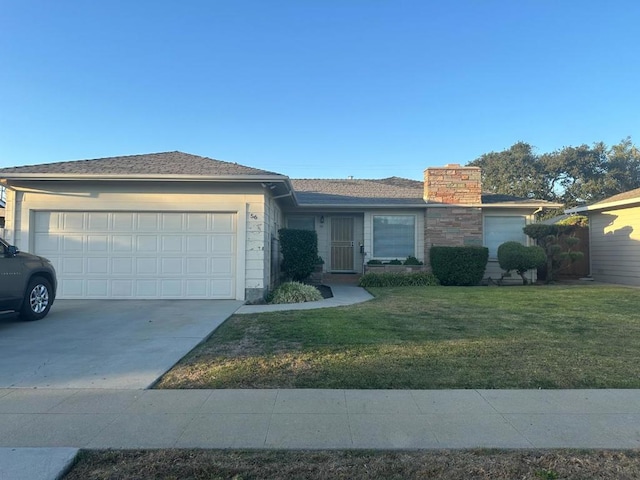 ranch-style house featuring a front yard and a garage