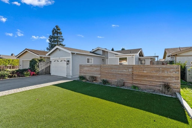 single story home with a garage and a front yard