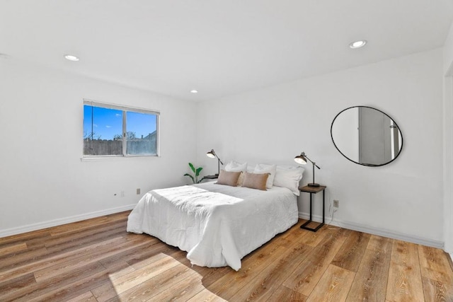 bedroom with light hardwood / wood-style flooring