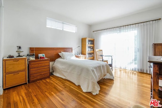 bedroom featuring light hardwood / wood-style floors