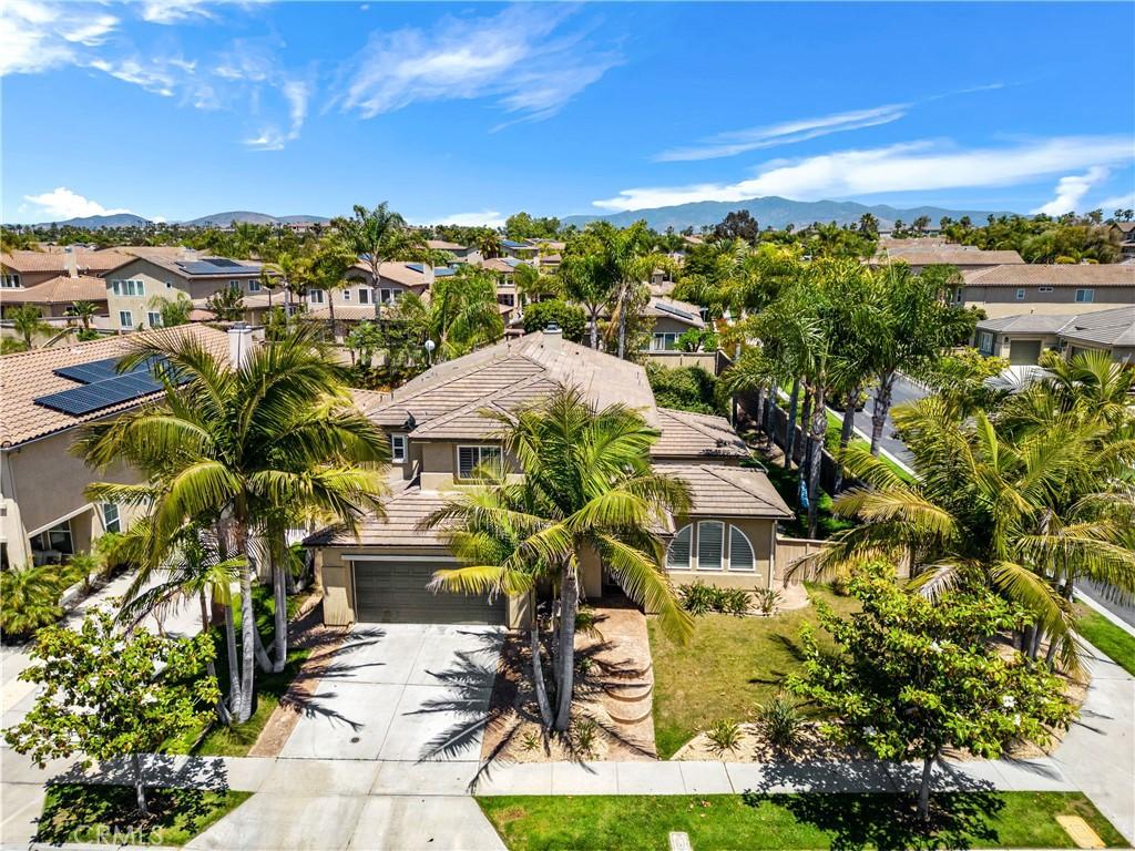 birds eye view of property with a mountain view