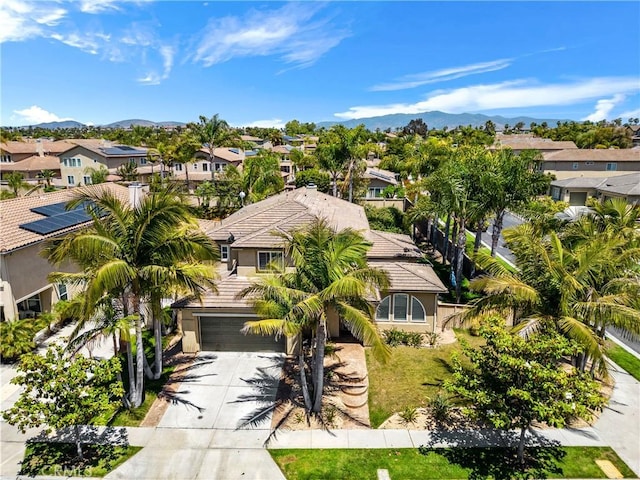 birds eye view of property with a mountain view