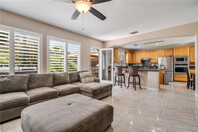 living room with ceiling fan