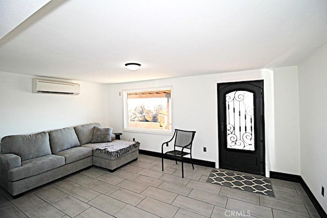 interior space with a wall mounted air conditioner and light tile patterned floors