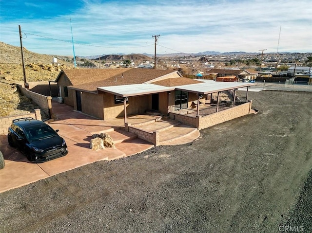 view of front of home featuring a mountain view